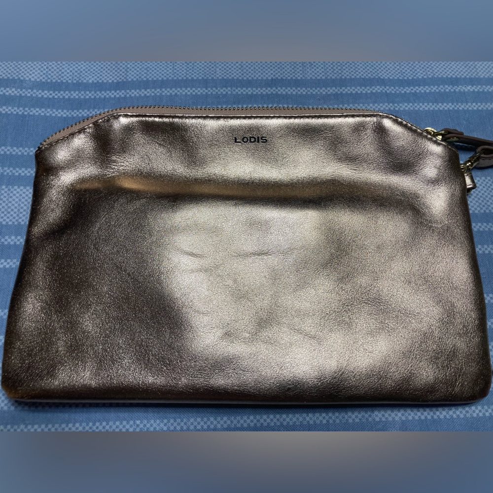 Lodis leather metallic rose gold wristlet.
